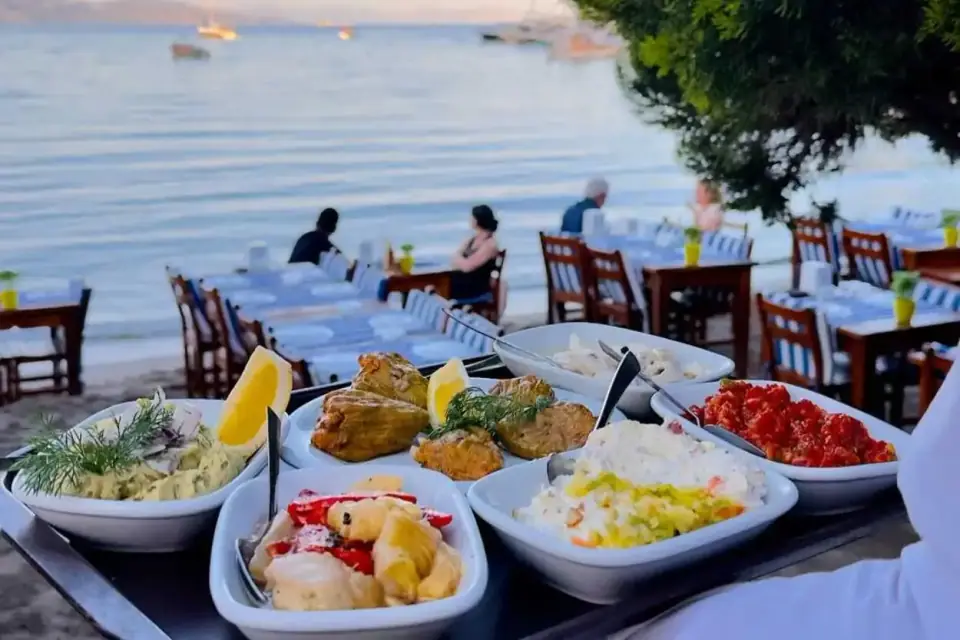 Plates of meze on a seaside restaurant table